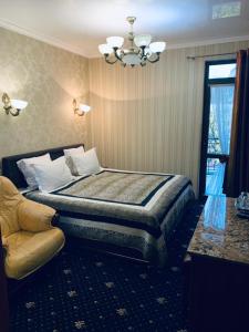 En eller flere senge i et værelse på Hotel Afrodita