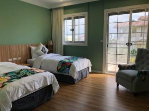 A bed or beds in a room at Dafu Qiandai Manor
