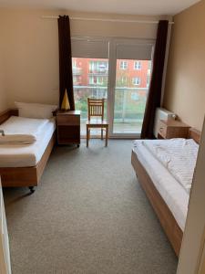 Postel nebo postele na pokoji v ubytování Suite Hotel Villa Erika