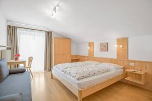 Postel nebo postele na pokoji v ubytování Residence krUma