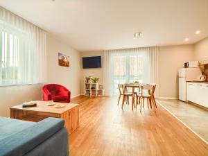 TV a/nebo společenská místnost v ubytování Apartamenty Szarotka