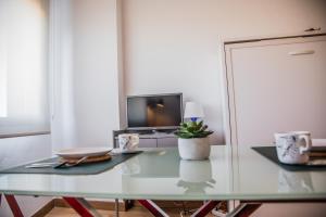TV a/nebo společenská místnost v ubytování FIBES Apart Loft by Valcambre