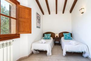 Ein Bett oder Betten in einem Zimmer der Unterkunft Villa La Rafal By homevillas360