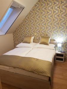 Posteľ alebo postele v izbe v ubytovaní Silver Lodge Apartments Eger