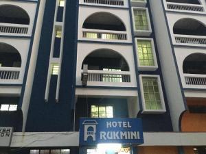 a hotel building with a sign in front of it at HOTEL RUKMINI in Vasco Da Gama
