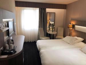 Postel nebo postele na pokoji v ubytování Best Western Marseille Aeroport
