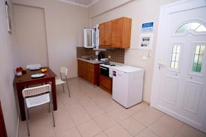 Kuchyň nebo kuchyňský kout v ubytování John Apartments First Floor + 34 fotografií