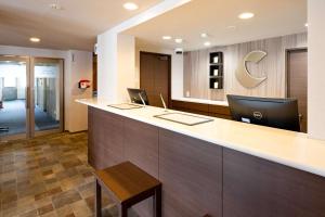 an office with a reception counter with a desk at Comfort Inn Kofu in Kofu