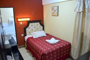 Postel nebo postele na pokoji v ubytování Hotel y Restaurante Castillo de los Altos