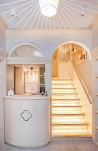 a staircase leading up to a kitchen with a stair case at Heritage Villa Nobile in Dubrovnik