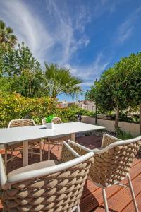 a patio with a table and chairs on a deck at Heritage Villa Nobile in Dubrovnik