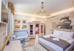 a bedroom with a bed with a ship on the wall at Heritage Villa Nobile in Dubrovnik
