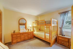 a bedroom with a bunk bed and a mirror at Mountainside Resort IV in Stowe