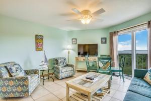 a living room with a couch and chairs and a table at Aqua Vista in Tavernier