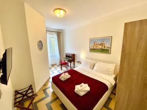 Ein Bett oder Betten in einem Zimmer der Unterkunft Domus Delphi