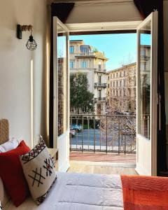 a bedroom with a bed and a view of a balcony at Lavagnini My Place B&B in Florence