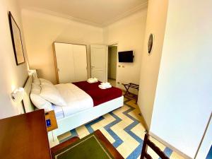 Ein Bett oder Betten in einem Zimmer der Unterkunft Domus Delphi