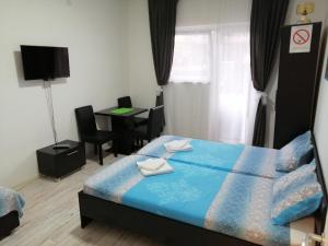 Voodi või voodid majutusasutuse Mitić Apartmani 1 toas