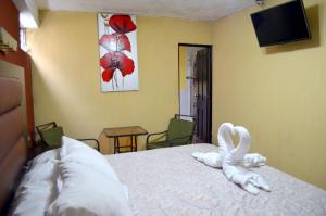 Postel nebo postele na pokoji v ubytování Hotel y Restaurante Castillo de los Altos