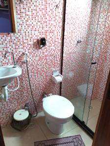 Um banheiro em Hotel Lumiar