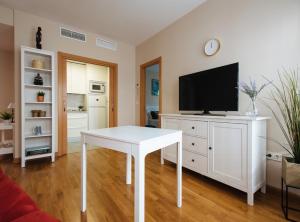 A television and/or entertainment centre at Torneo Suite Apartment Még 6 kép