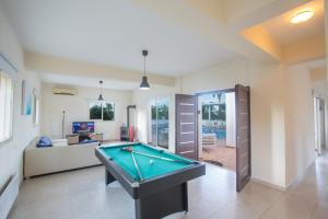 a living room with a pool table in it at Villa Orka in Protaras