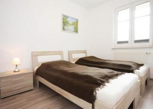 Katil atau katil-katil dalam bilik di Strandschloesschen-Haus-II-WE-11-9644