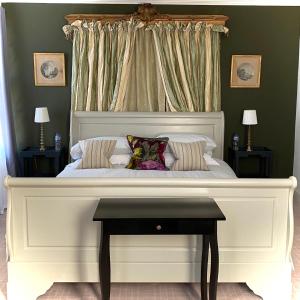 a large bed with a white headboard in a bedroom at Merchant39 in Folkestone