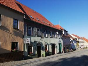 an empty street in a town with buildings at W sercu Srebrnej Góry in Srebrna Góra