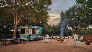 a food truck with chairs and a table and a fire at Four Seasons Hotel Austin in Austin