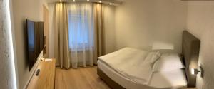 Giường trong phòng chung tại Hotel Lindenhof