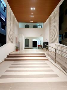 an empty hallway of a building with stairs at A29 Benoni Garden Suites in Papar