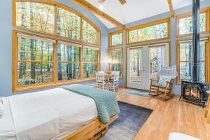 a bedroom with a bed and a fireplace at Saltbox in Thompsonville