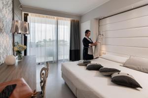 Postel nebo postele na pokoji v ubytování Mec Paestum Hotel