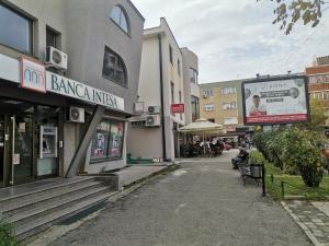 an empty street in a city with buildings at STAN na DAN PEX FREE PARKING in Vranje