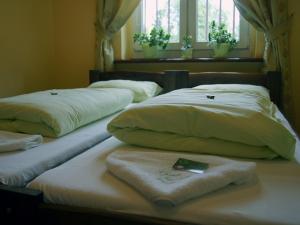 Postel nebo postele na pokoji v ubytování Green Hostel Wrocław przy ZOO