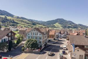 an aerial view of a town with a mountain at Gästezimmer im Dorfzentrum in Rothenthurm