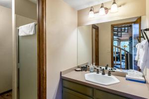 a bathroom with a sink and a mirror at Heartstone Hideaway in Breckenridge +23 photos