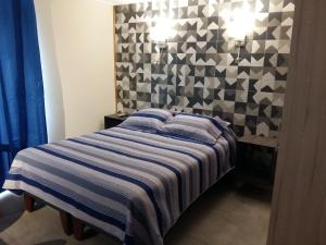سرير أو أسرّة في غرفة في Lodging Quirinal