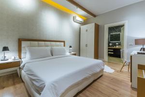Postel nebo postele na pokoji v ubytování Villa Ester