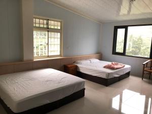Una cama o camas en una habitación de Bao Chi B&B