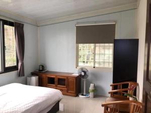 Una cama o camas en una habitación de Bao Chi B&B