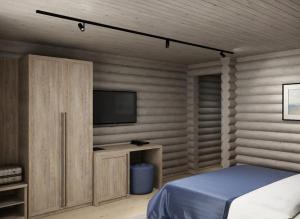 アナパにあるHotel White beach All Inclusiveのベッドルーム(ベッド1台、薄型テレビ付)