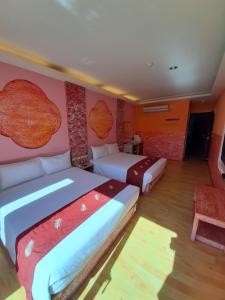 Voodi või voodid majutusasutuse 墾丁大街 皇佳旅店 toas
