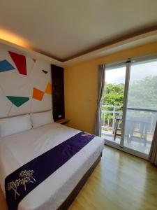 Voodi või voodid majutusasutuse 墾丁大街 皇佳旅店 toas