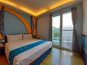 Voodi või voodid majutusasutuse 墾丁大街 皇佳旅店 toas