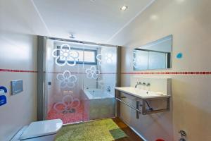 a bathroom with a shower with a sink and a toilet at 206 Villa Isabel ET2341 by Mallorca Charme in Alcudia +18 photos
