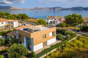 an image of a house with a view of the water at 206 Villa Isabel ET2341 by Mallorca Charme in Alcudia