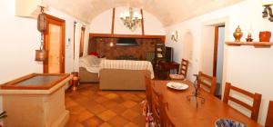 a living room with a table and a dining room at 411 Finca Sa Costa ETV1976 by Mallorca Charme in Campos