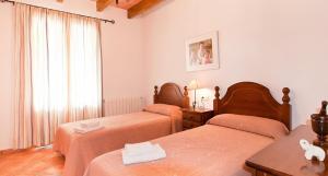 A bed or beds in a room at 404 Finca Can Mates Nou VT 1720 by Mallorca Charme